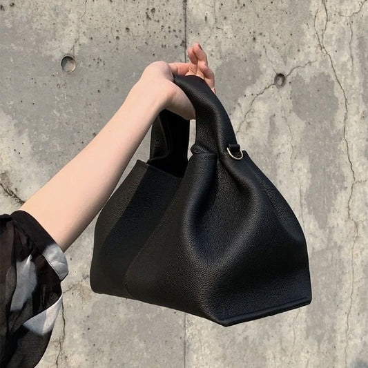Black Cloud Shaped Crossbody Bag by AriaLuxe, featuring a unique design and sturdy handles. Ideal for stylish outings.
