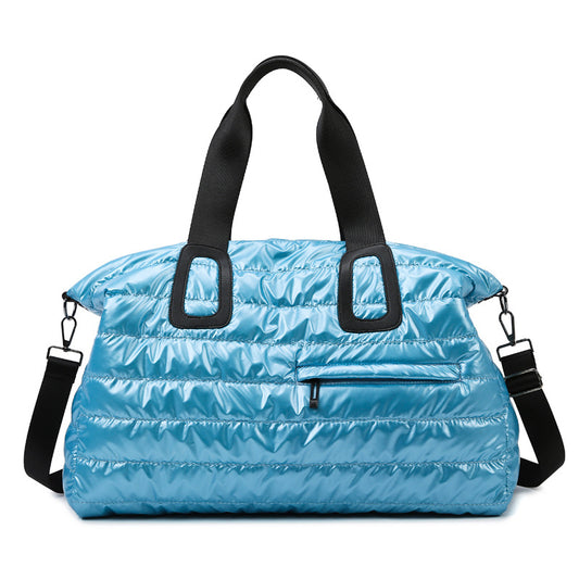 Lightweight waterproof gym sports bag by AriaLuxe in shiny blue with black straps and a front zip pocket.