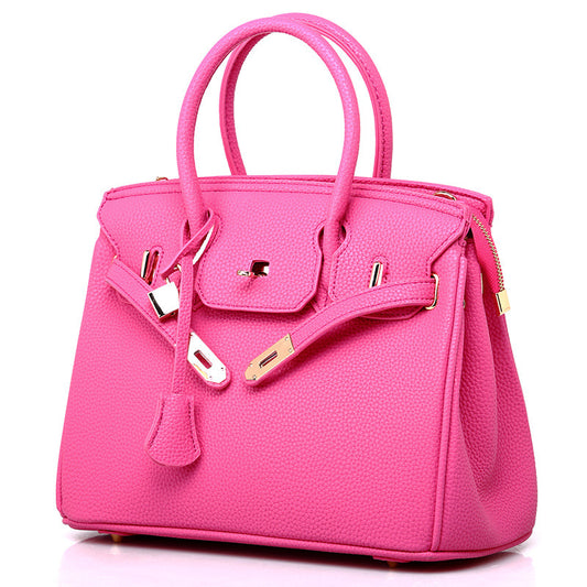 Euro Luxe Pebbled Texture Platinum Shoulder Handbag in vibrant pink with gold-tone hardware and dual top handles.