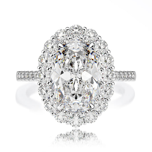 Double Halo Oval Ring featuring a 4.5 carat center stone surrounded by smaller diamonds in sterling silver. Elegant and spark