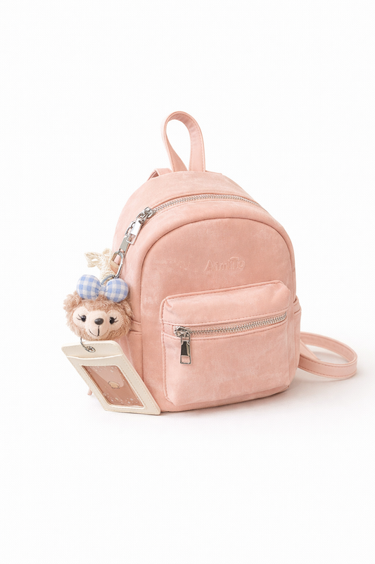 Pink Aria Muse Mini Backpack featuring a front zipper pocket and a cute bear charm with a blue bow.