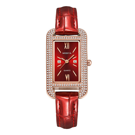 Deco Diamond-Cut Rectangle Watch features a red dial, rose gold accents, and a sparkling diamond-cut bezel with a red leather