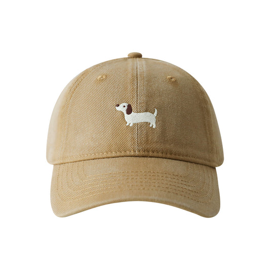 Everyday Pup Cotton Cap in tan with a cute embroidered dog design on the front. Adjustable strap at the back.
