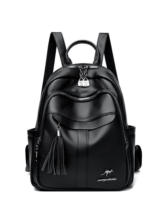 Black Bella Backpack featuring a textured finish, front pocket, tassel detail, and adjustable straps. Ideal for everyday use.