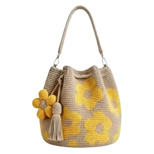 Crochet Tote Bag by AriaLuxe featuring a beige and yellow floral design with a tassel and flower embellishment.